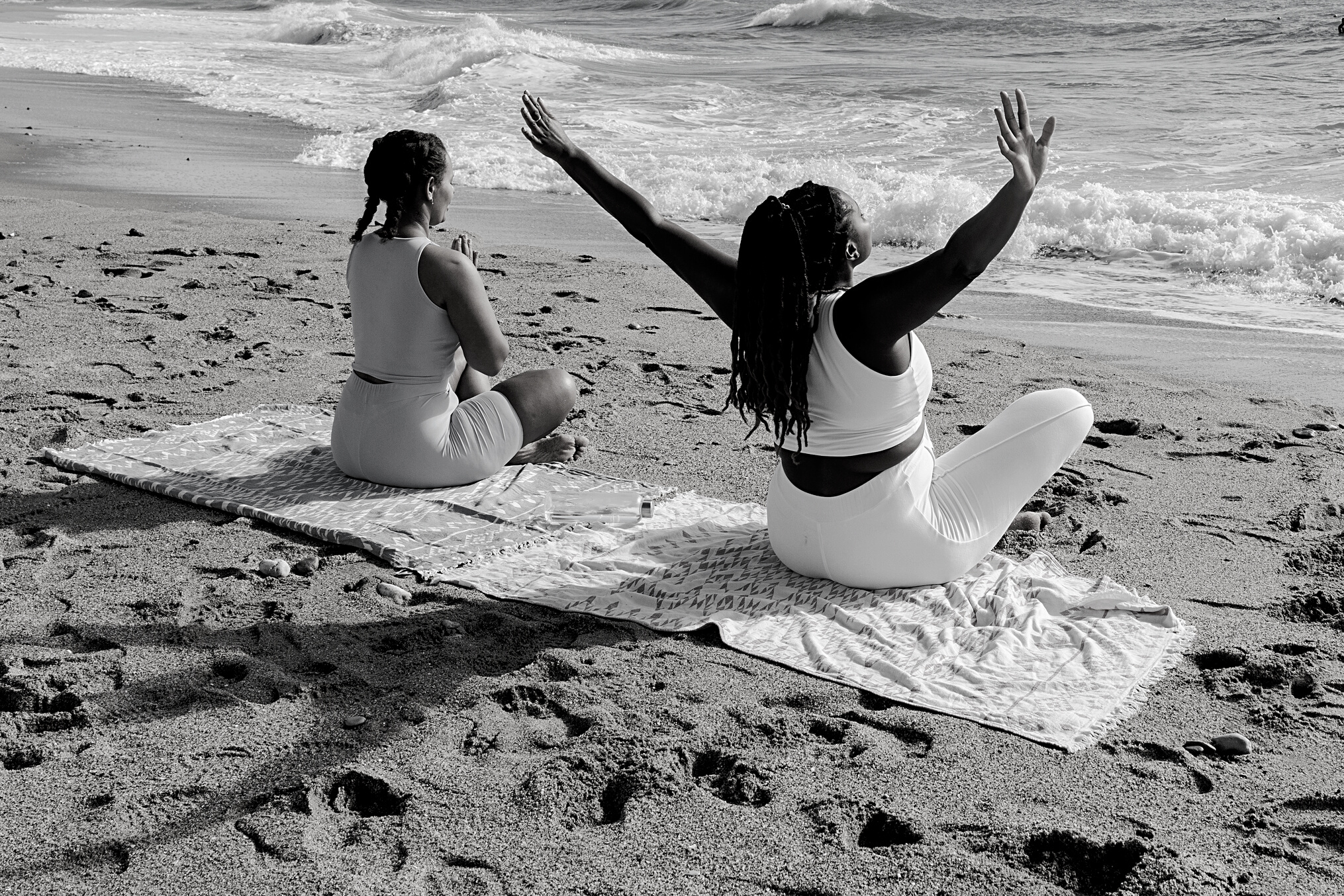 Women Meditating at the Beach